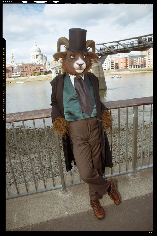 anthro bridge classy clothed clothing costume europe fully_clothed fursuit hat headgear headwear horn looking_at_viewer male necktie real solo suit top_hat gallenw bovid caprine goat mammal