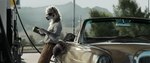 anthro belt book car clothed clothing eyewear gas_station glasses male neckfluff reading reading_book solo street sunglasses tail vehicle geewolf the_hangover canid canine canis mammal wolf 2024 digital_media_(artwork) hi_res signature