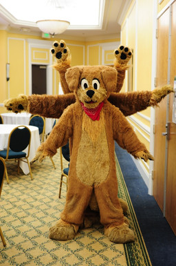 ambiguous_anthro ambiguous_gender anthro baseboard black_eyes brown_body carpet ceiling ceiling_lamp chair clothing costume dining_room dining_table door featureless_crotch furniture fursuit group heart_symbol inside kerchief lamp light male neckerchief neckwear neo-classical_architecture real red_kerchief red_neckerchief solo_focus tablecloth wall_(structure) jd_puppy vitruvian_man canid canine canis domestic_dog mammal colored grandfathered_content inspired_by_formal_art lighting photography_(artwork)