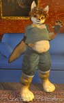 3d_background 4_toes anthro bottomwear chest_tuft clothed clothing clothing_lift denim denim_bottomwear denim_clothing denim_shorts eyewear feet fingerless_gloves furniture glasses gloves greeting hair hand_behind_back handwear male overweight shirt shirt_lift shorts smile sofa solo tail text toes topwear tuft young young_anthro young_male jackthorn jackal_pawpad canid canine canis jackal mammal 2014 3d_(artwork) 5:8 digital_media_(artwork) signature