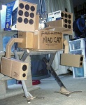 ambiguous_gender battlemech box cardboard cardboard_box container cosplay feral gun_arm machine mecha missile_launcher missile_pod ranged_weapon real rocket_launcher shoulder_missiles solo weapon what unknown_artist battletech mechwarrior mad_cat domestic_cat felid feline felis mammal robot full-length_portrait grandfathered_content photography_(artwork) portrait sculpture_(artwork) traditional_media_(artwork)