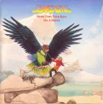 1973 20th_century album_cover ambiguous_gender ancient_art anthro armor avian band beach beak bird black_body black_feathers breastplate budgerigar budgie_(band) cover detailed_background duo english_text feathered_wings feathers feet feral green_body green_feathers harness headgear helmet lake landscape logo loriinae male melee_weapon metal mountain nest no_pupils official_art outside painting_(artwork) parakeet parrot pulley rock roger_dean rope sand scabbard seaside size_difference sky snow spikes spread_wings sword talons text toes traditional_media_(artwork) true_parrot water watercolor_(artwork) weapon wings yellow_eyes