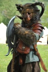 anthro armor axe bag clothing costume detailed_background forest fursuit horn larp male melee_weapon outside plant real solo sword tent tree warrior weapon wood fragrach bovid caprine goat mammal grandfathered_content photography_(artwork)