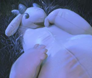 ambiguous_anthro ambiguous_gender anthro blue_eyes blue_grass blue_light detailed_background grass inflatable latex light lying on_back on_grass on_ground open_mouth open_smile plant realistic realistic_lighting smile solo water-s animate_inanimate bovid caprine goat living_inflatable living_pool_toy mammal 2026 detailed lighting shaded