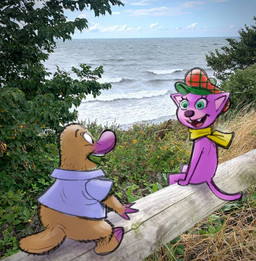 anthro brown_body brown_fur clothing duo female fur grass green_eyes hat headgear headwear male open_mouth photo_background plant scarf seaside shirt sitting smile standing tail topwear yellow_scarf stefan_fjeldmark eye_candy_film platy_and_puss platy_(platy_and_puss) puss_(platy_and_puss) domestic_cat felid feline felis mammal monotreme platypus 2021 mixed_media photography_(artwork)