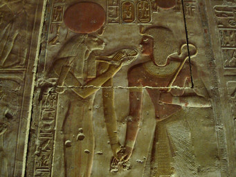 carving clothing crown duo egyptian egyptian_clothing egyptian_headdress female headdress headgear headwear male nemes_(clothing) photo radiant_crown rock sculpture standing sun uraeus unknown_artist egyptian_mythology middle_eastern_mythology mythology sekhmet deity felid human lion mammal pantherine ancient_art grandfathered_content hieroglyphic_text