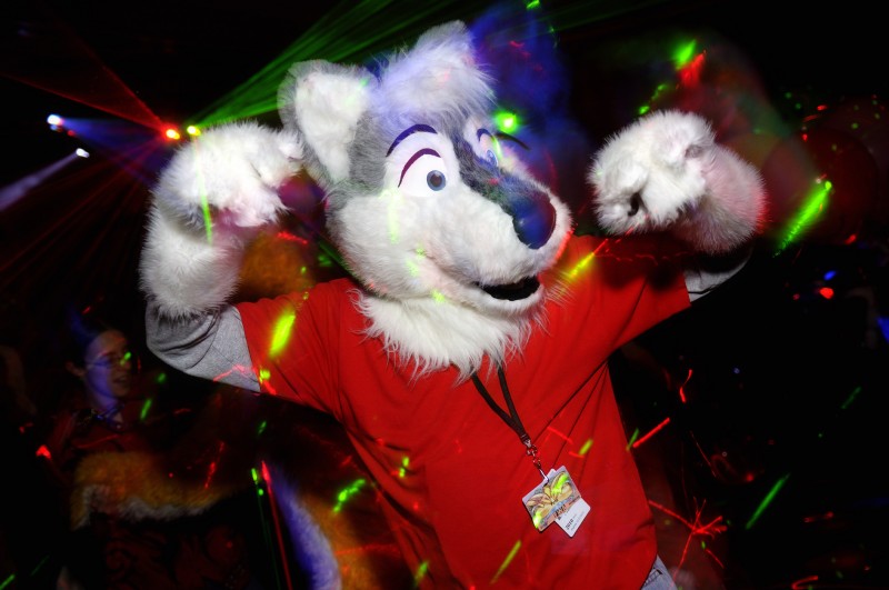 anthro blue_eyes clothing costume dancing duo fursuit laser male rave real solo_focus char_(photographer) canid canine canis domestic_dog mammal wolf absurd_res hi_res