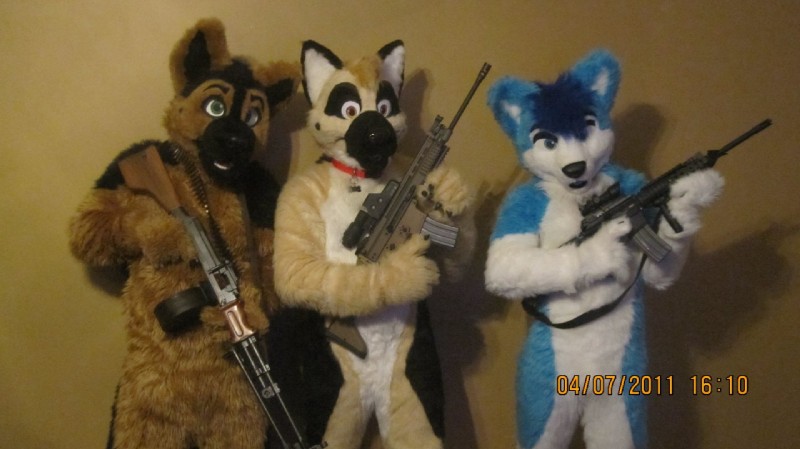 ambiguous_gender ammunition anthro ar-15 bandolier clothing collar costume fn_scar front_view fursuit group gun number o'clock ranged_weapon real rifle rpd simple_background snout stoner_rifle time timestamp weapon year unknown_artist jaceshepherd sako223 yawnilutrova canid canine canis domestic_dog mammal 2011 dated grandfathered_content photography_(artwork)