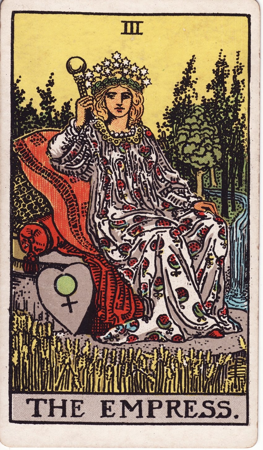 blonde_hair card clothed clothing crown detailed_background female female_symbol field forest gender_symbol hair headgear heart_symbol human_only looking_at_viewer major_arcana not_furry pillow plant river roman_numeral sky solo symbol tarot tarot_card the_empress_(tarot) tree wheat wheat_field yellow_sky pamela_colman_smith human mammal 1910 20th_century ancient_art hi_res signature