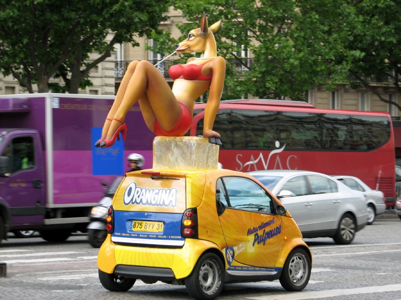 advertisement anthro bikini clothed clothing compact_car europe female france gem ice_cube paris pearl_(gem) real skimpy smart_car solo street swimwear tight_clothing two-piece_swimsuit ffl_paris orangina deer mammal 4:3